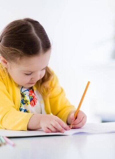 Image of young child writing