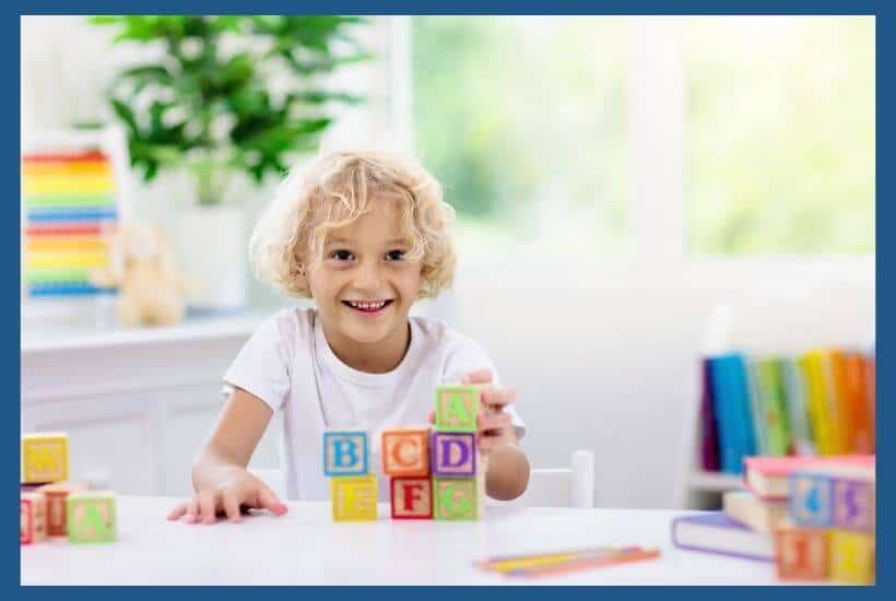 Image of preschooler practicing letter recognition