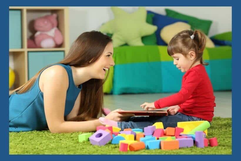 Mother teaching young child shapes