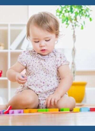 Toddler playing with educational toy