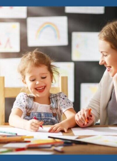 teacher working with kindergarten student