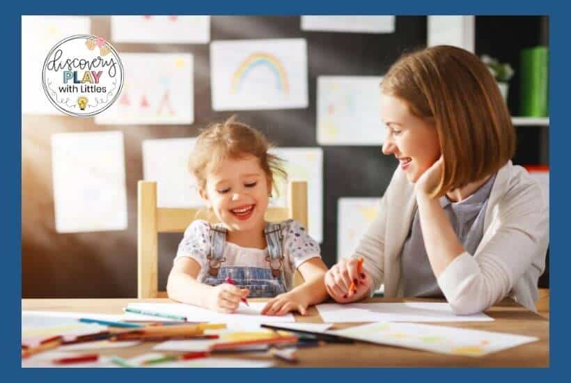 teacher working with kindergarten student