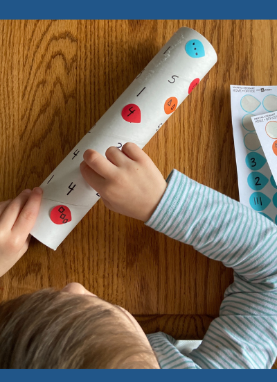 Boy using dot stickers for subitizing practice