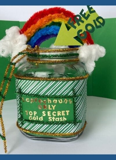 Image of leprechaun trap made of a jar, green paper, and a rainbow