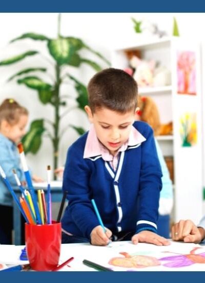 Image of Preschool teacher working with kids on all about me project