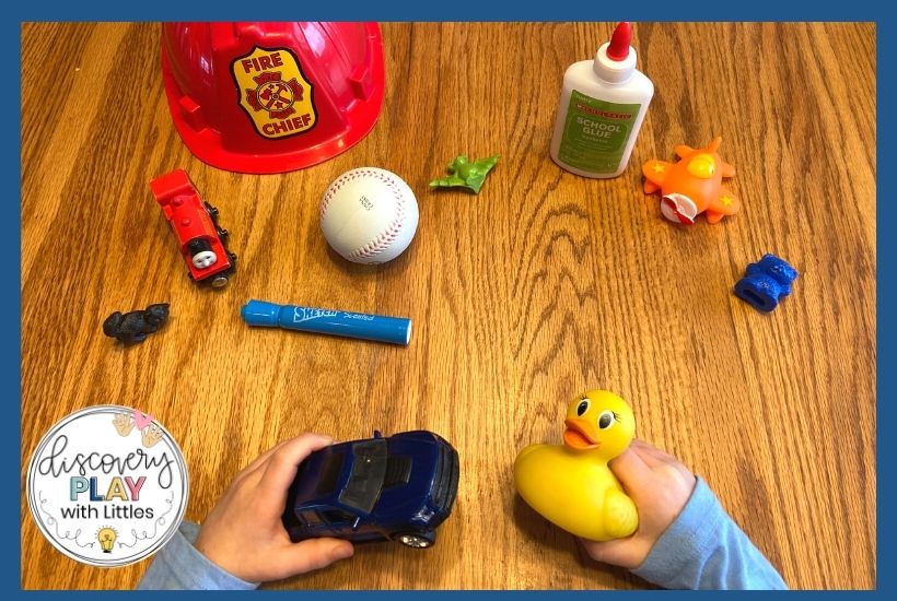 Image of young boy practicing rhyming with toys