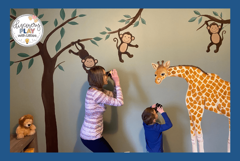 Image of preschooler looking at safari animals