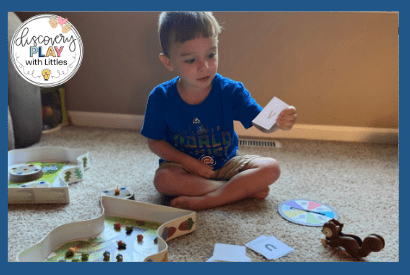 Image of letter recognition practice with board game