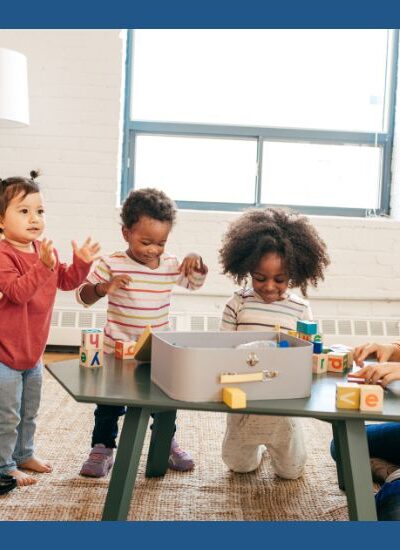 Toddlers playing with wooden blocks